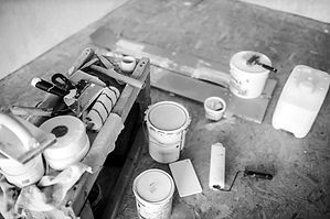 Painting supplies on plywood floor_edited.jpg