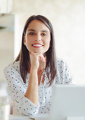 personal branding photography image of a young woman sitting behind her laptop
