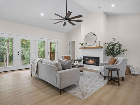 Open concept living area with fireplace and dining space at 9 Dahlgreen