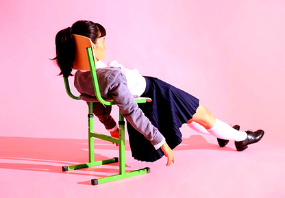 Girl frustrated laying on a chair