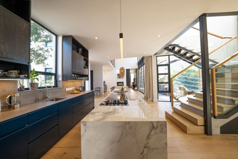 Architects build new contemporary house in Southern suburbs, boasting a modern granite kitchen.