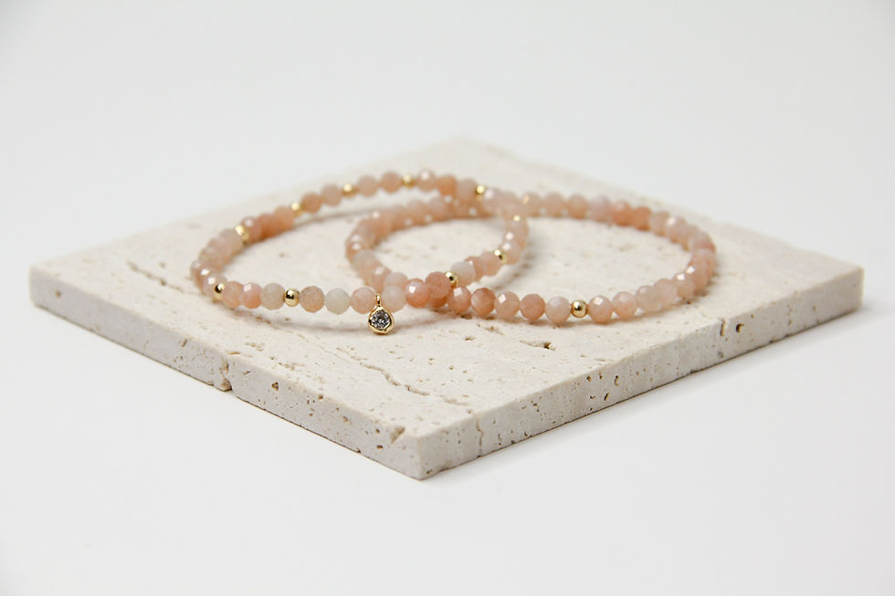 peach moonstone stretch bracelet set with gold filled spacers or sterling silver and cubic zirconia charm