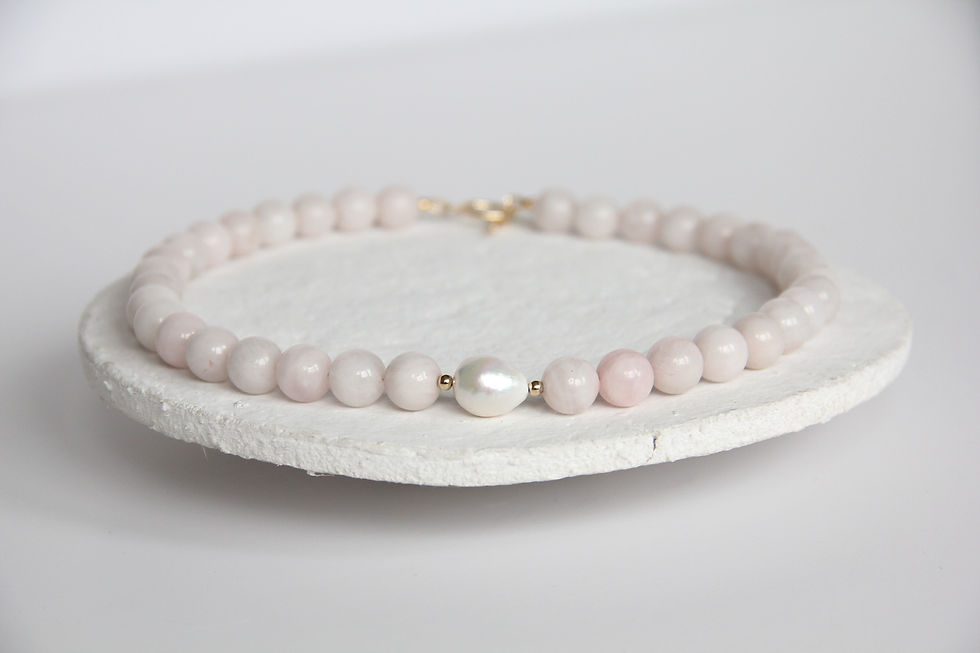 milky rose quartz beaded necklace with a white freshwater edison pearl at its centre