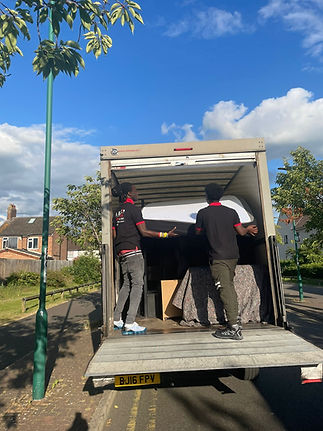 two workers loading van 