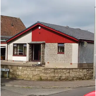 house with red cladding