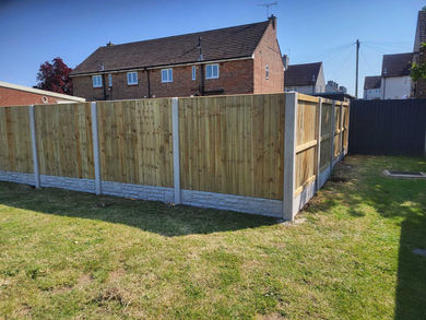 fence corner in garden with house behind