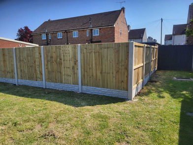 fence corner in garden with house behind