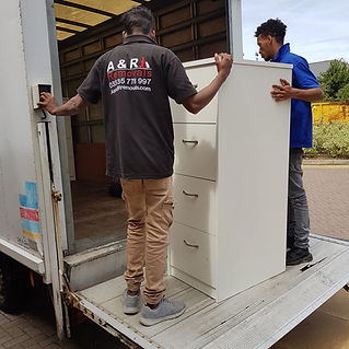 drawers being loaded onto a van 