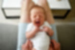 baby on dads knee yawning | family photographer durham | Angela Fenwick Photography