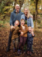 family huddled together outdoors | family photographer durham | Angela Fenwick Photography