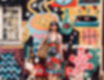 woman stood against colourful wall | natural family photographer Durham | Angela Fenwick Photography