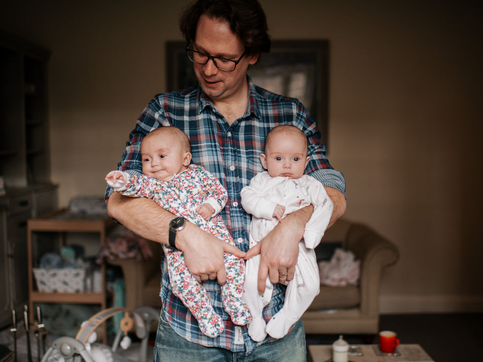 dad holding newborn twins | newborn photography newcastle | Angela Fenwick Photography
