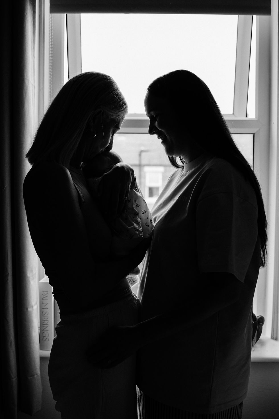 parents holding newborn baby during a photoshoot at home in Tyneside
