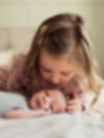 little girl kissing newborn family photographer durham | Angela Fenwick Photography