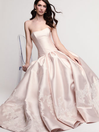 Verandi is a dimensional ball gown in Milan Mikado with a soft, dainty sweetheart neckline and a slightly lowered drop waist that lengthens the silhouette. Sida Floral Motifs in varied sizes add soft twinkle and texture. The cathedral skirt brings full drama in Ivory or Soft Blush.