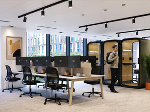 workspace with modern office pods and acoustic booths