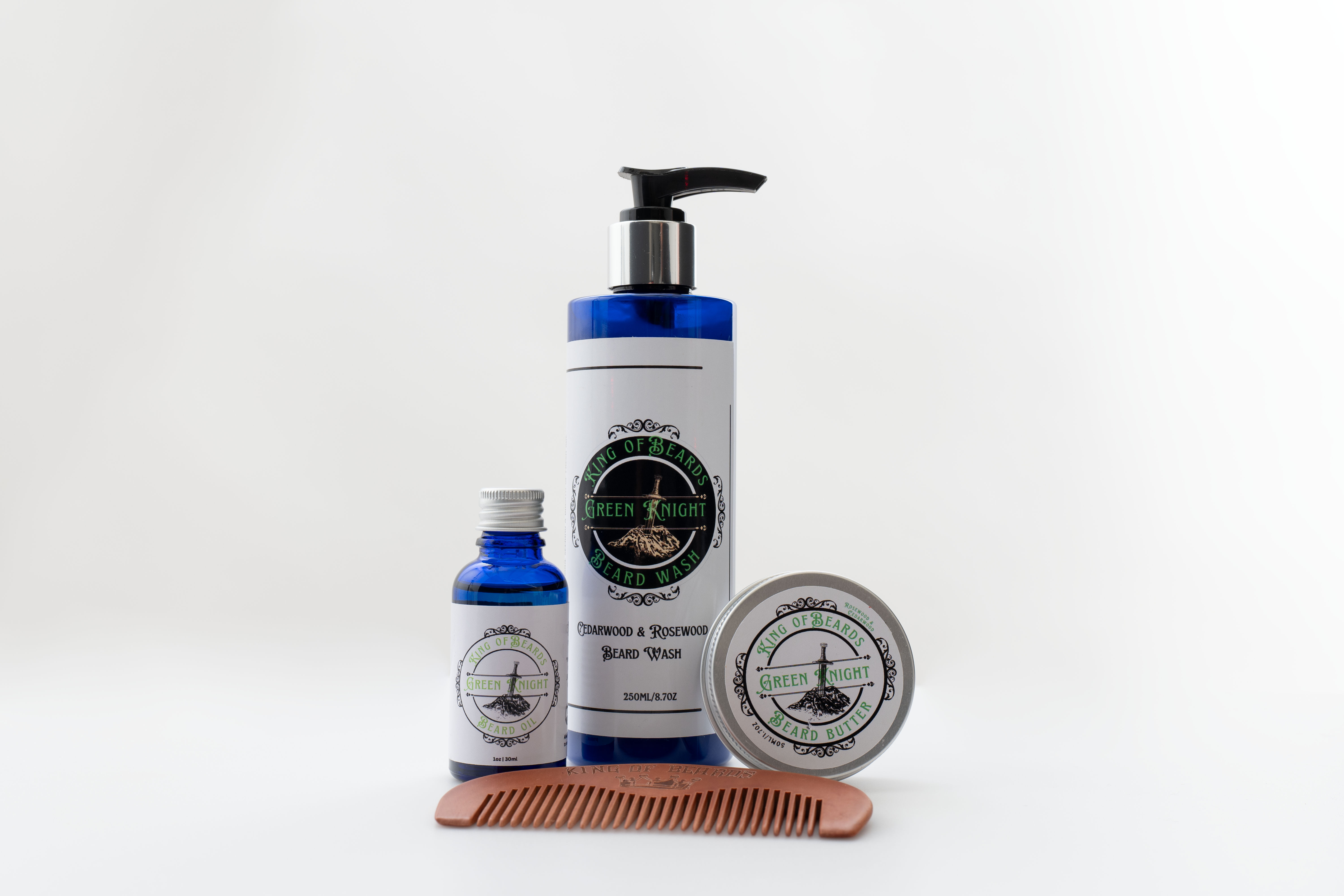 A beautiful set of royal blue beard products including, oil, shampoo, butter and a wooden comb