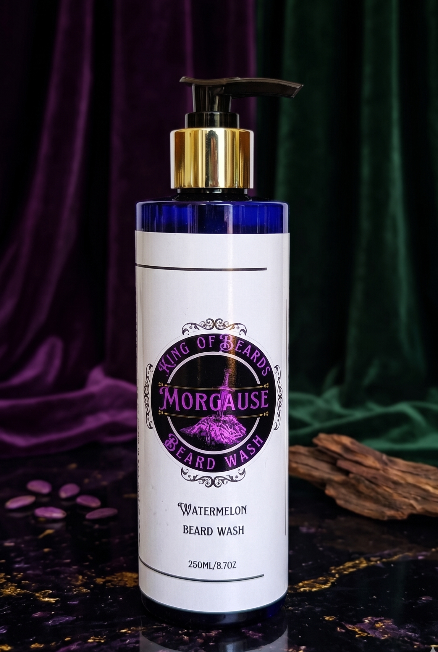 A 250ml bottle of Morgause Beard Wash with a gold pump cap, displayed on a dark surface with a fragment of natural bark on th