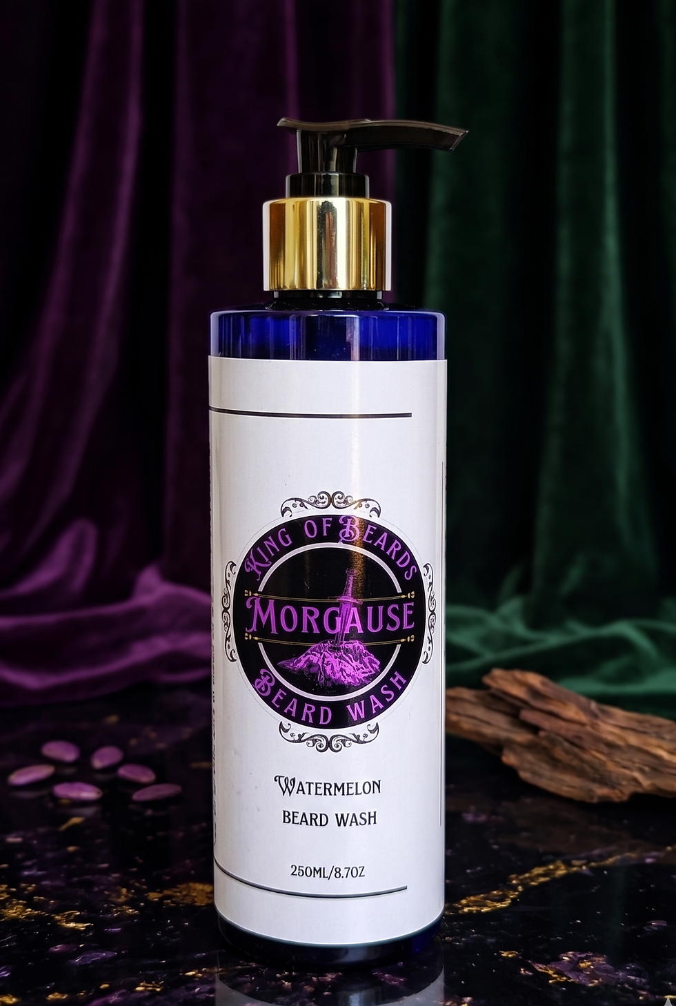A 250ml bottle of Morgause Beard Wash with a gold pump cap, displayed on a dark surface with a fragment of natural bark on th