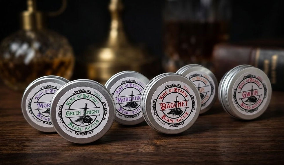 A line of six King of Beards beard butter tins standing upright on a rustic wooden table with vintage glass bottles blurred i
