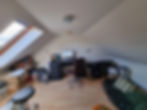 a cluttered attic office space