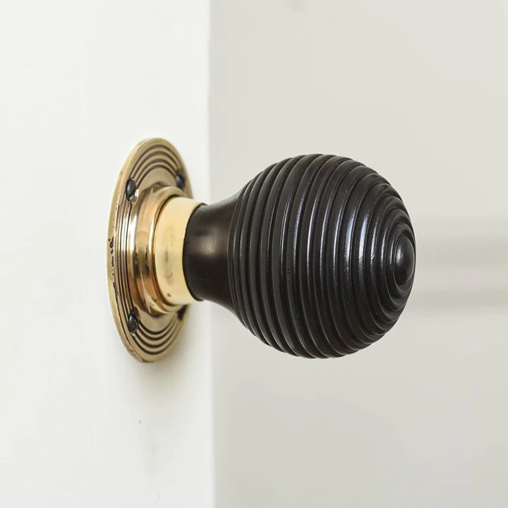 Ebony and brass beehive door knob