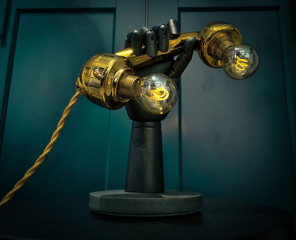 Thumbnail: black articulated hand holding a gold retro telephone handset