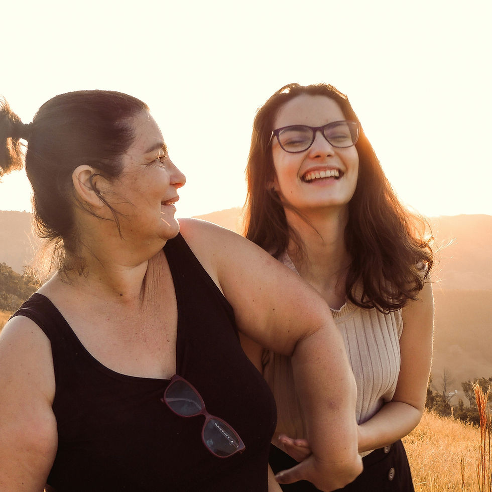 Mother and daughter walking and smiling together.