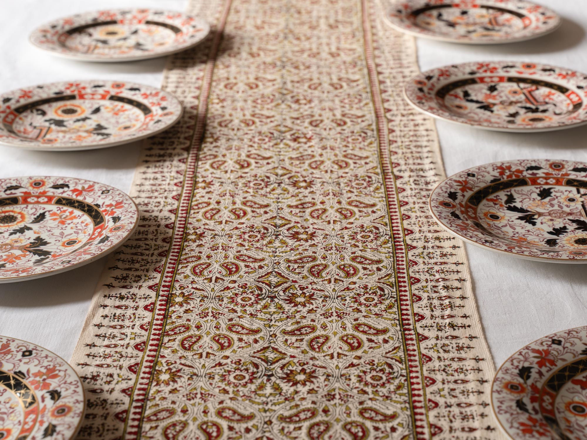 Elegant table runner hand block printed in wine red and olive green