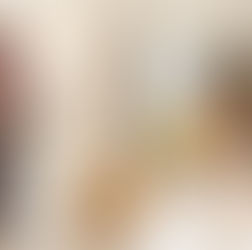 Parents smile by windows; kids joyfully dance near a bed. 