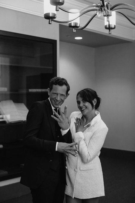 Black and white wedding couple signing at City Hall New York City
