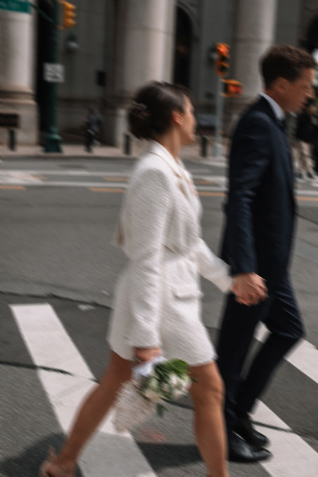 Wedding couple crossing street Lower Manhattan New York City