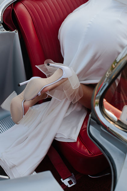 Couple shoes heels detail vintage Corvette red leather interior New York
