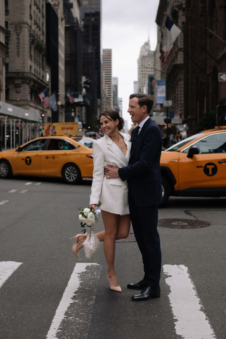 Wedding couple with yellow taxi Midtown Manhattan New York City