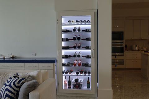 custom wine cabinet Boca Raton Florida, compact luxury wine storage, illuminated wine display, premium materials, elegant wine cabinet, Dragon Cellars