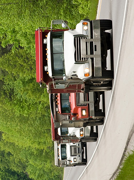 dump-trucks-on-highway_BKbzhTpNo_edited.