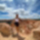 Brittni Cosgrove, personal and professional coach, works 1:1 with people to transform their lfie from the inside out. Here she is standing in front of Bryce Canyon.