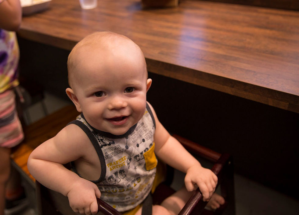 Baby smiling and being happy at capital tacos!