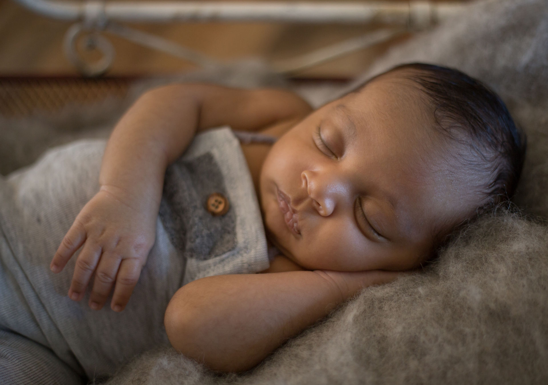 newborn baby boy in gray