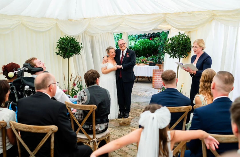 Couple celebrating their marriage at home with closest family and friends