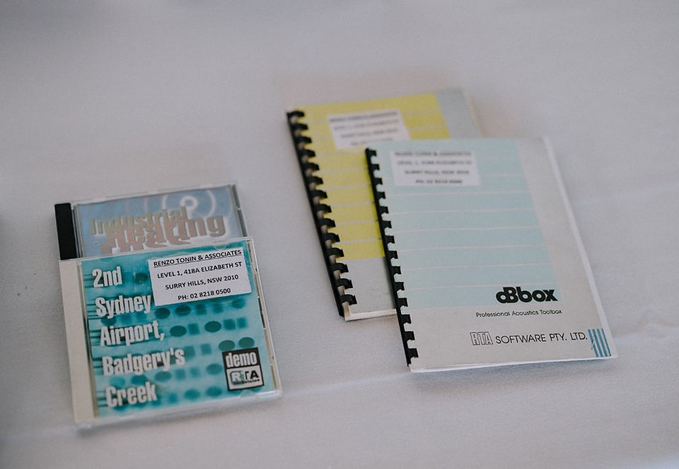 2 spiral bound books and 2 CD cases on a table