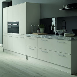 Vivo Matt Light Grey Kitchen Doors
The Vivo kitchen door is the epitome of pared-down, modern door design. This plain-fronted slab door really allows whatever finish you choose to take centre-stage. If you’re looking to give your kitchen a bit of TLC, but don’t have endless time and money to spend on it, simply replacing the doors will give the room an instant lift. We think choosing plain, simple handles will accentuate those crisp, minimalist lines, so have a look at our Accessories page for elegant bar or bow-shaped handles.
Matt Light Grey is a fashionable shade – grey in various shades has been a popular interiors colour for a few years now. Matt Light Grey is pale enough to brighten a small kitchen, but it will still make a stylish impact in a larger, more airy room. Play up that cool freshness by pairing your Vivo Matt Light Grey doors with white metro tiles on the walls and blond wood floorboards. In a spacious room, you could also use darker, more intense greys on the floor or worktops, for an updated take on chic monochrome. Add splashes of warmth with copper fittings and accessories in blush pinks – your kitchen will be a welcoming haven for you, your family and friends.