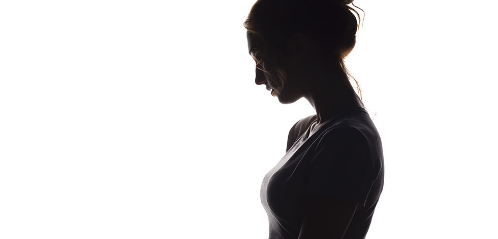 profile silhouette of a pensive girl, a young sad woman lowered her head down on a white i