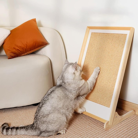 L-shaped cat scratching board that looks like wall art. It features a grey cat scratching it.