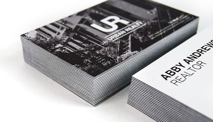 Small Stack of Alternating Designs on Black Oreo Business Cards