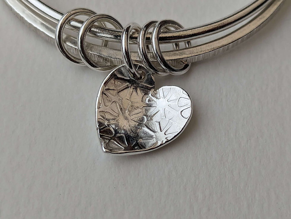 Thumbnail: Flower textured heart and rings double bangle.