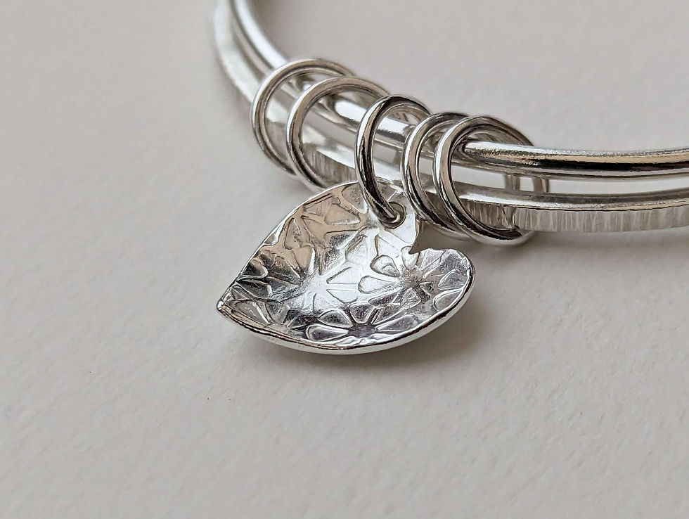 Thumbnail: Flower textured heart and rings double bangle.
