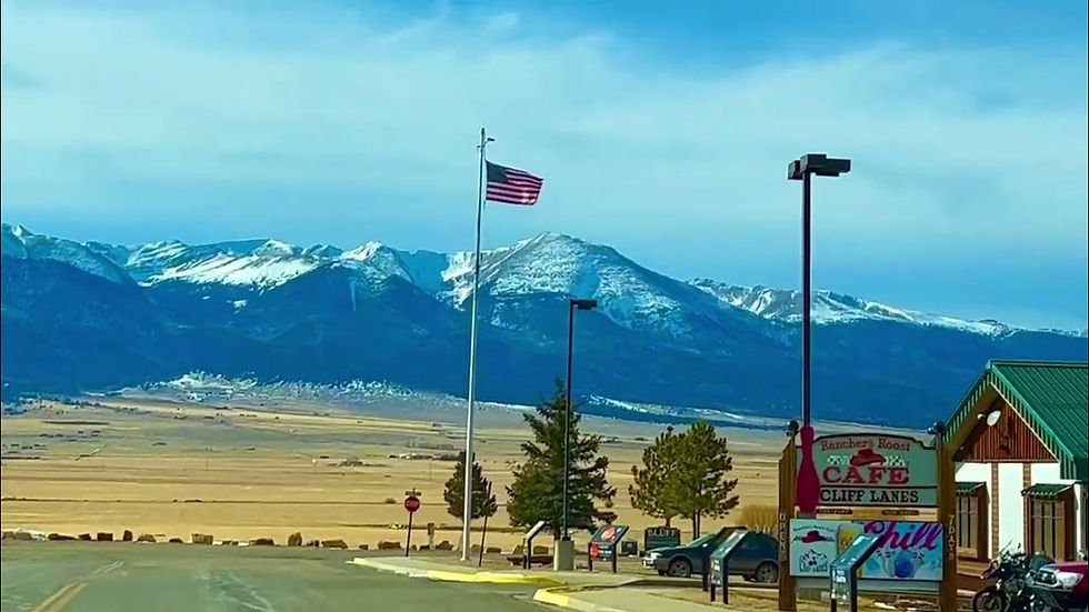 Outside of Cliff Lanes with Sangre de Cristo Mountains in the background