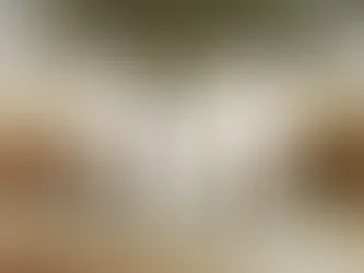 Five people in white outfits stand under a tree, holding hands. The background is a serene landscape at sunset with a warm, tranquil mood.