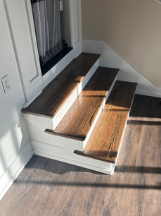 A set of interior steps with hardwood built by Elite Renovation LLC Rhode Island